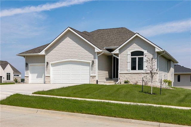 view of front of house with a garage and a front lawn