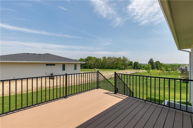 wooden deck with a lawn