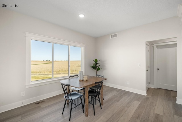 dining area with light wood-type flooring