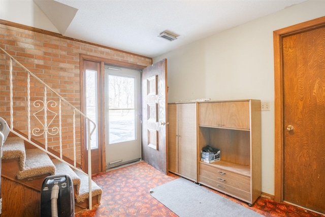 entryway featuring carpet flooring