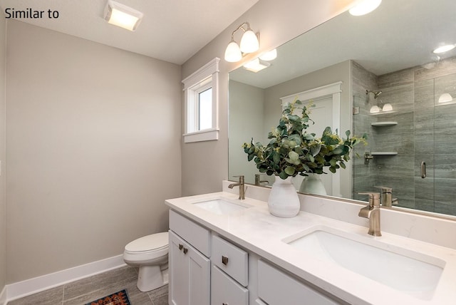 bathroom with tile patterned flooring, vanity, toilet, and an enclosed shower