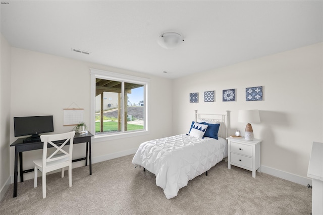 bedroom with light colored carpet