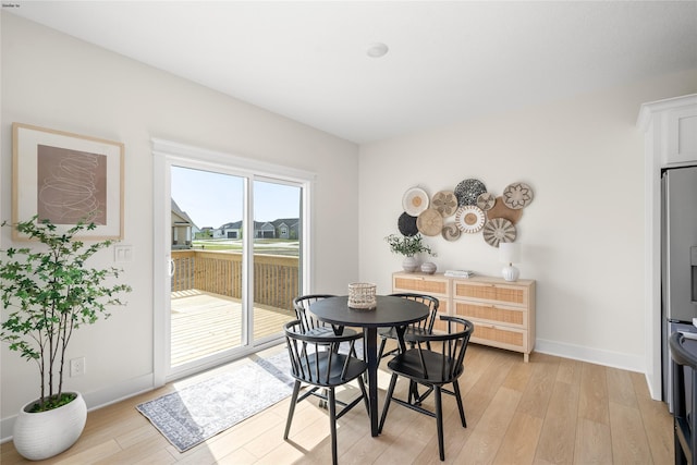 dining space featuring light hardwood / wood-style floors