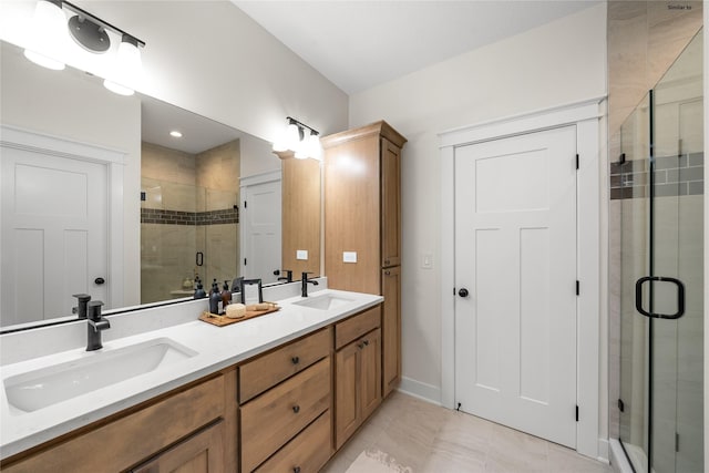 bathroom featuring tile patterned flooring, vanity, and walk in shower