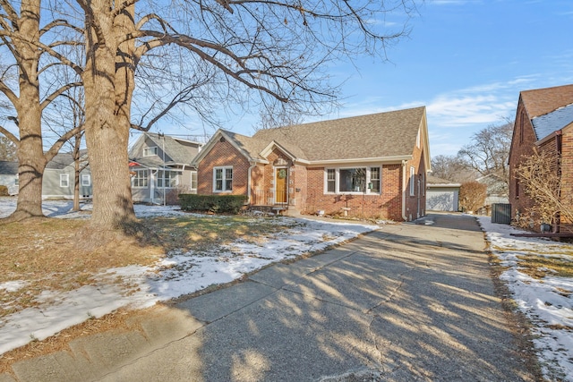 view of front facade with a garage and an outdoor structure