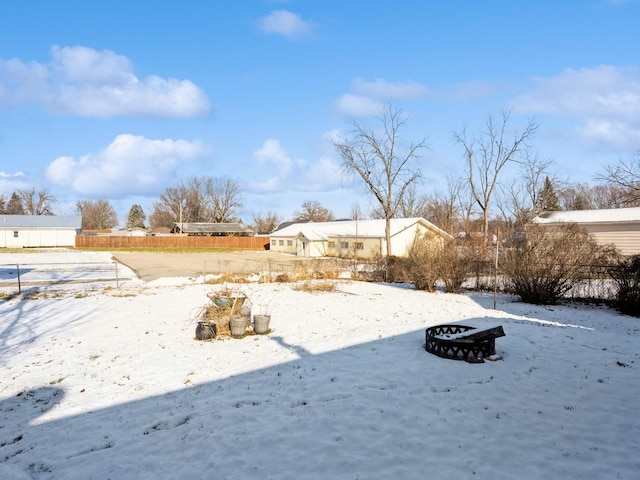 view of yard layered in snow