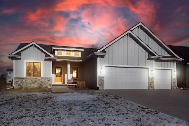 view of front of house featuring a porch and a garage