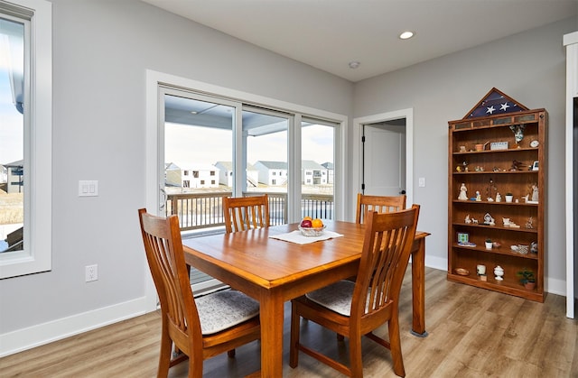 dining area with light hardwood / wood-style flooring