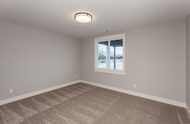 empty room featuring carpet flooring