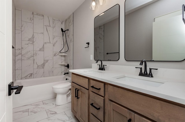 full bathroom with vanity, toilet, and tiled shower / bath