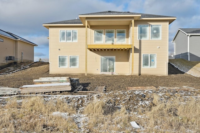 rear view of house with central air condition unit