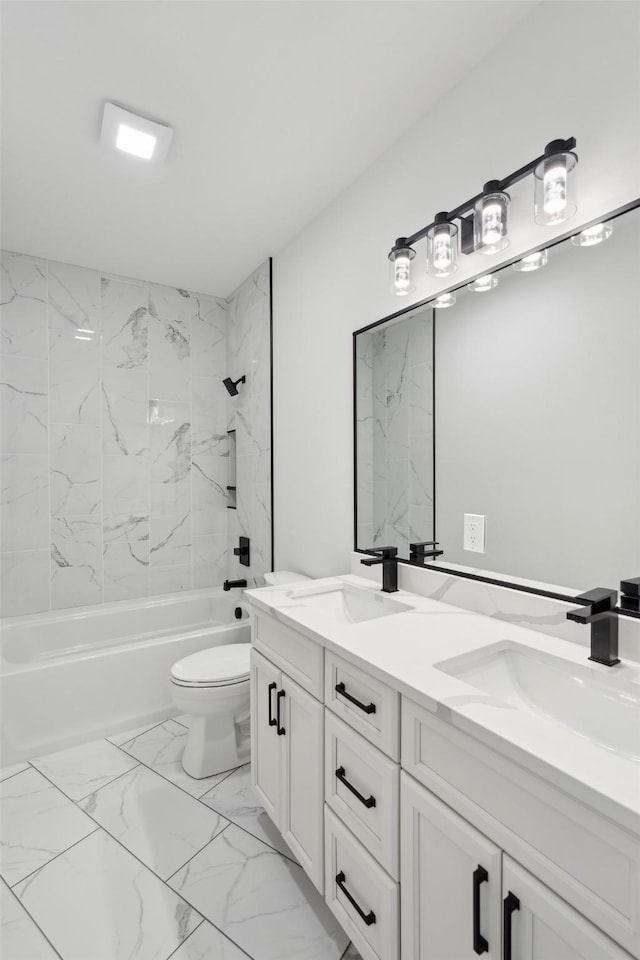 full bathroom with double vanity, marble finish floor, shower / bathing tub combination, and a sink