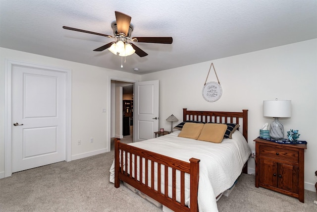 490 Bella Vista Ct, Huxley, IA 50124 - bedroom with light carpet, baseboards, and a ceiling fan