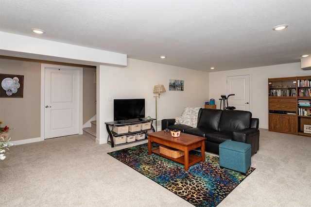 living room with light carpet and a textured ceiling