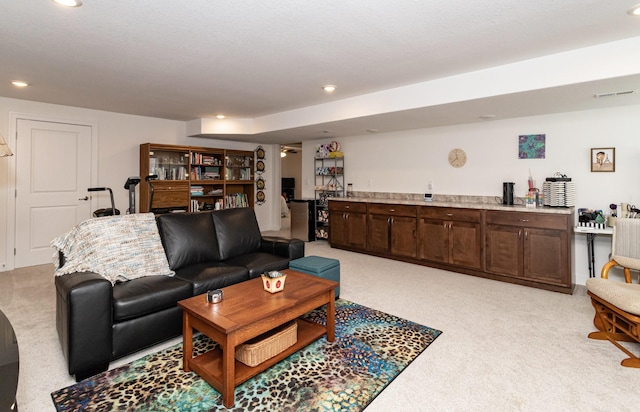 490 Bella Vista Ct, Huxley, IA 50124 - living room featuring light carpet, recessed lighting, and bar area