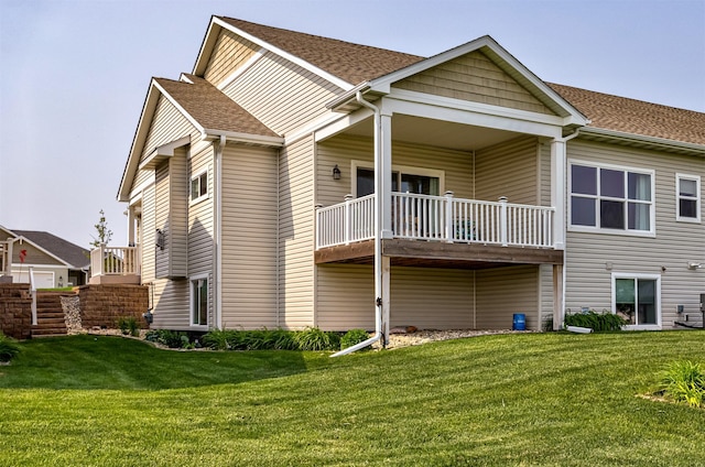 490 Bella Vista Ct, Huxley, IA 50124 - rear view of property with a shingled roof, a lawn, and a balcony