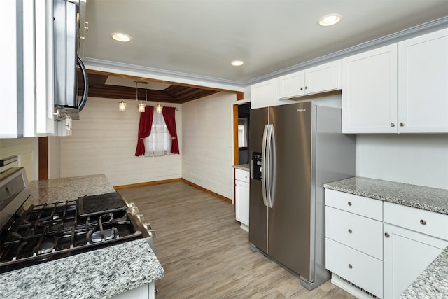 kitchen featuring white cabinets, light stone countertops, stainless steel refrigerator with ice dispenser, and ornamental molding