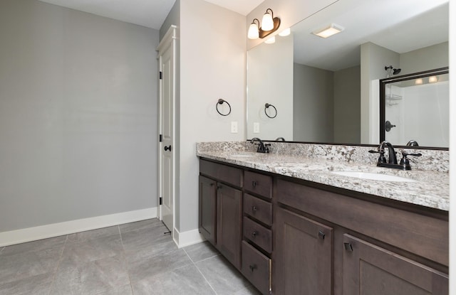 bathroom with tile patterned flooring and vanity