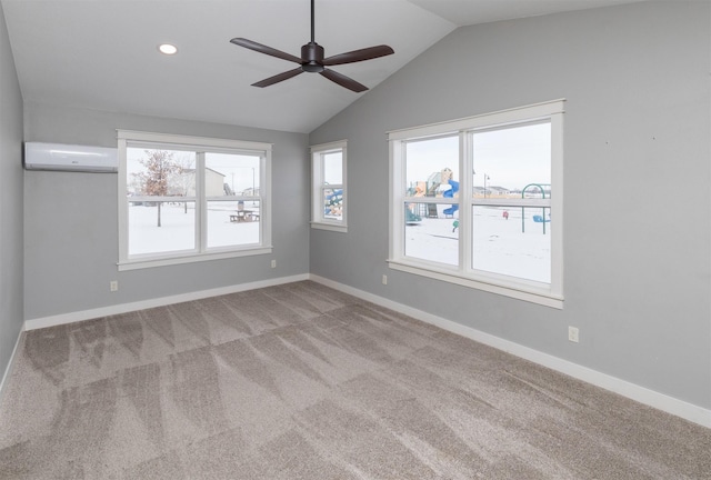 carpeted spare room featuring a wall mounted air conditioner, vaulted ceiling, and ceiling fan