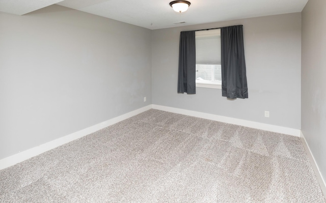 empty room with carpet flooring