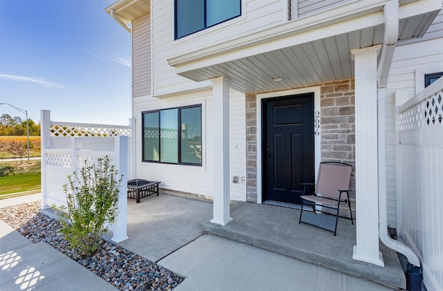 doorway to property with covered porch