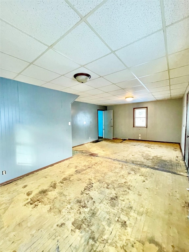 basement featuring a drop ceiling