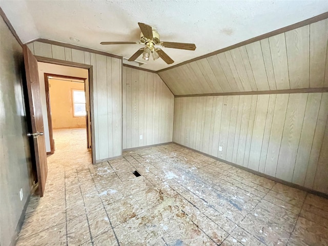 bonus room featuring vaulted ceiling and ceiling fan