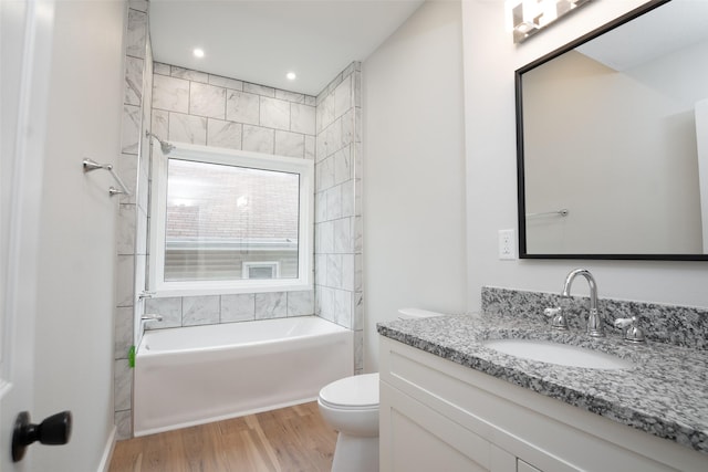 bathroom featuring hardwood / wood-style floors, vanity, and toilet