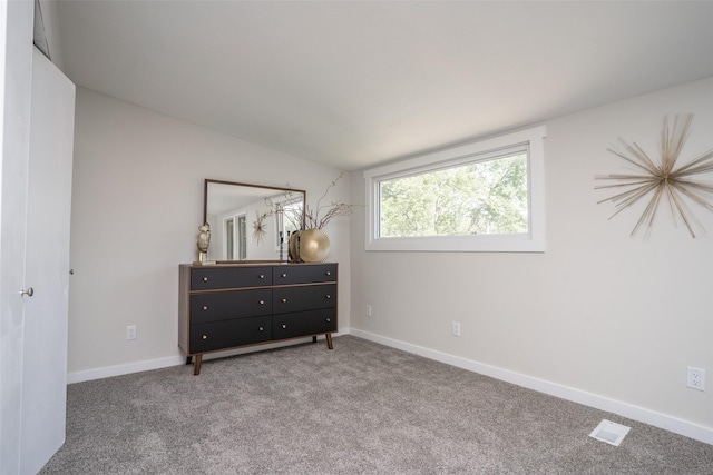 1141 Euclid Ave, Des Moines, IA 50313 - carpeted bedroom with baseboards and vaulted ceiling