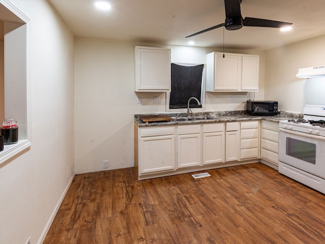 kitchen with white range with gas stovetop, white cabinets, dark hardwood / wood-style floors, and sink