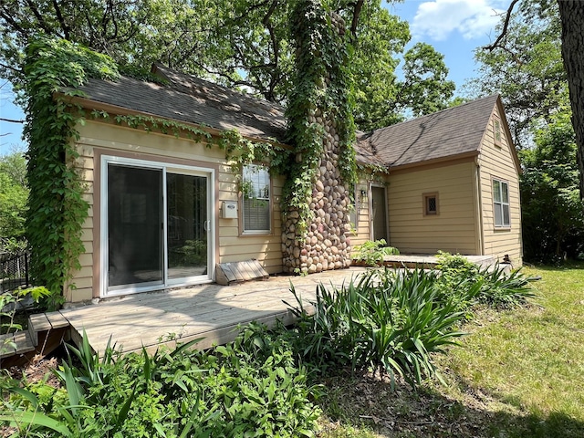 back of house with a wooden deck