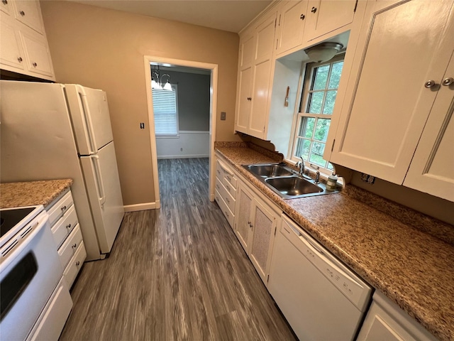 kitchen with sink, dark hardwood / wood-style flooring, a chandelier, white appliances, and white cabinets