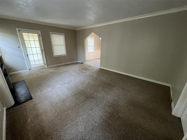 unfurnished room featuring plenty of natural light and ornamental molding