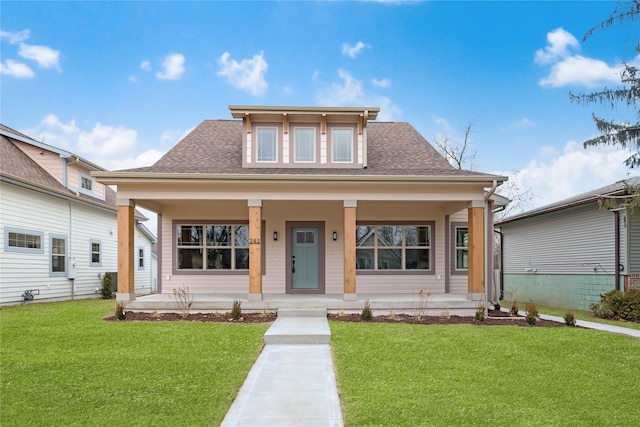 view of front of property with covered porch and a front lawn