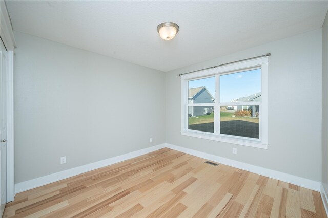 unfurnished room featuring light hardwood / wood-style flooring