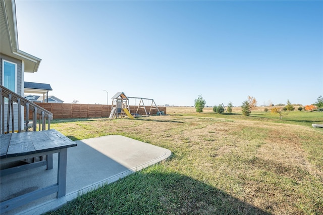 view of yard with a patio area and a playground