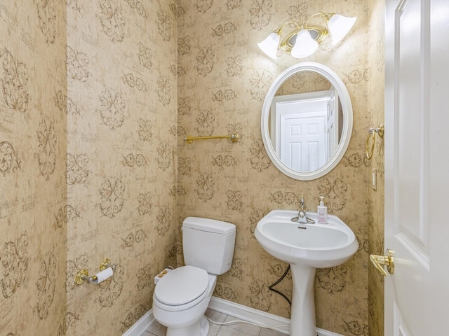 bathroom with tile patterned flooring and toilet