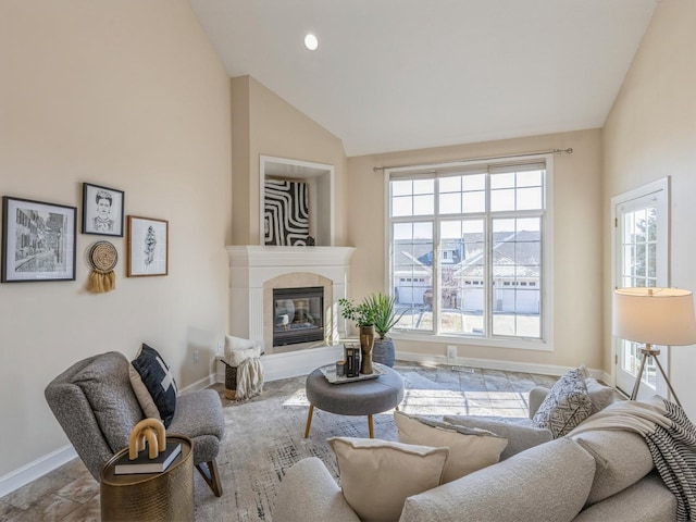 living room featuring lofted ceiling