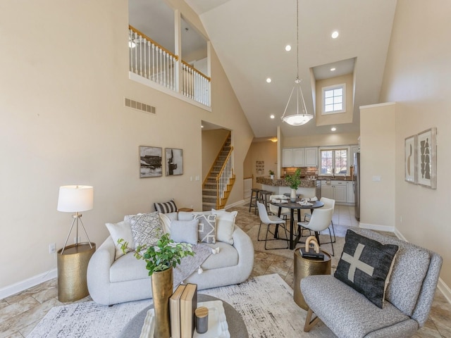 living room with a towering ceiling