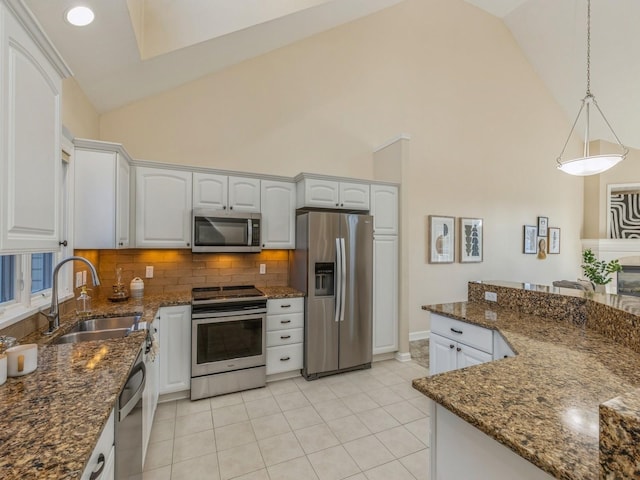 kitchen with white cabinetry, sink, pendant lighting, and appliances with stainless steel finishes