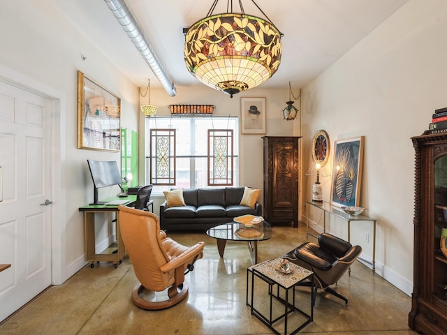 living area with concrete floors