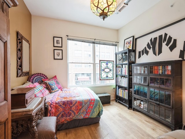 bedroom with light hardwood / wood-style floors