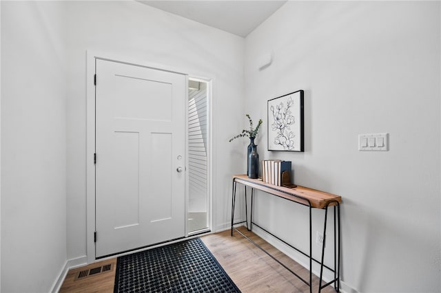 foyer entrance with light wood-type flooring