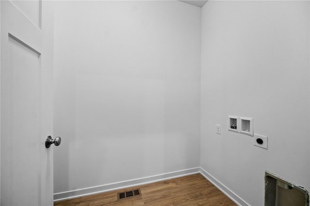 clothes washing area featuring washer hookup, electric dryer hookup, and dark hardwood / wood-style floors