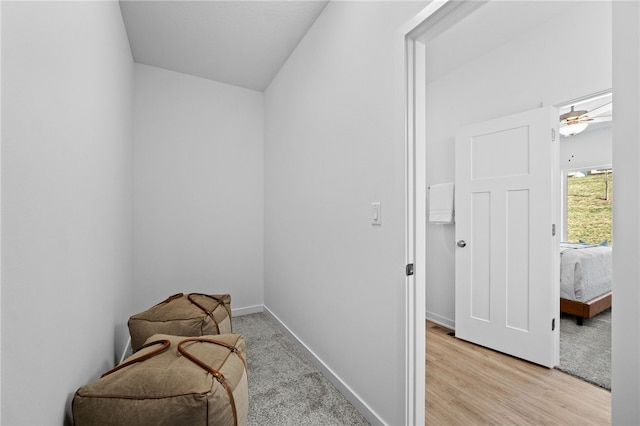 sitting room featuring light wood-type flooring and ceiling fan