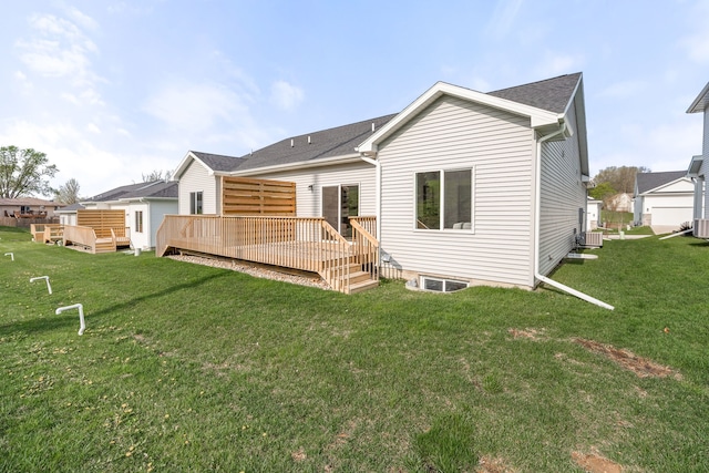 back of property featuring a lawn, a wooden deck, and cooling unit