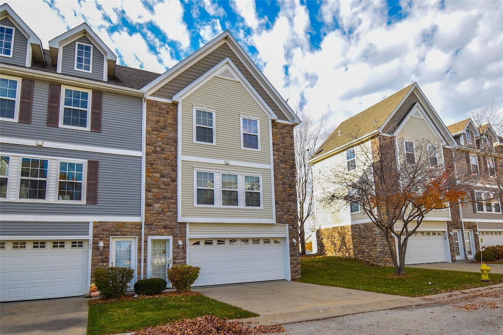 townhome / multi-family property featuring a garage