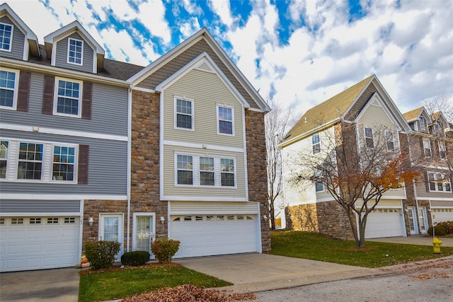 townhome / multi-family property featuring a garage