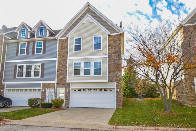 view of front of house with a front yard and a garage