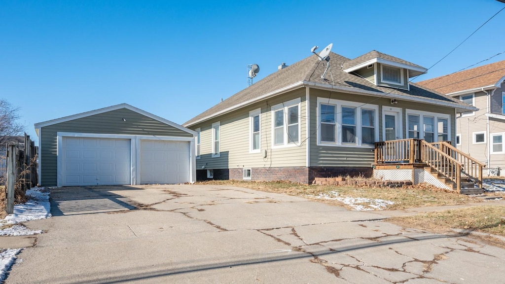 view of front of house with an outbuilding and a garage